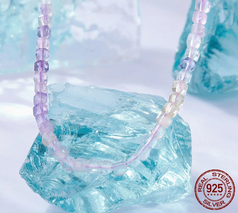Necklace with purple and clear beads on a light blue crystal background, featuring the Bamoer brand.