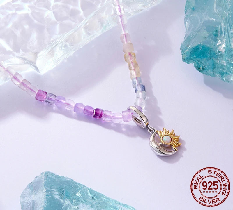 Necklace with a sun-shaped pendant and beaded chain on a light background with 'bamoer' branding.