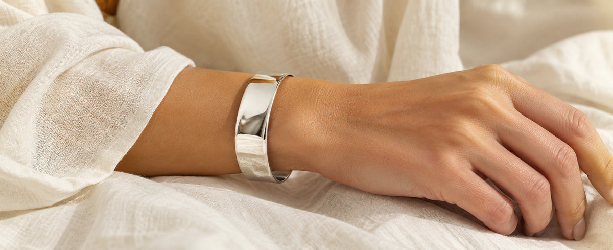 Polished sterling silver open cuff worn on the wrist for Jewelry Towns cuff bracelet guide