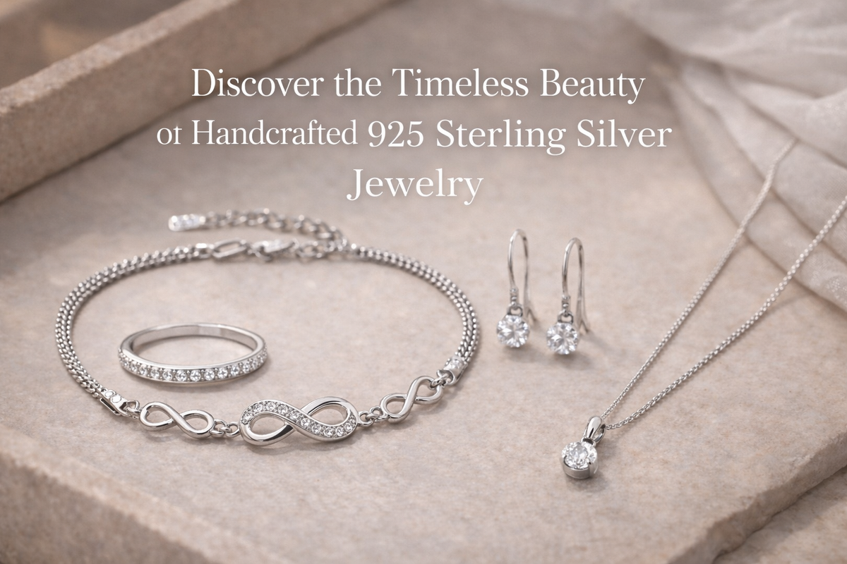 Handcrafted 925 sterling silver jewelry set arranged on a soft beige stone surface, featuring an infinity bracelet, a delicate ring, drop earrings, and a solitaire pendant necklace in an elegant editorial style.