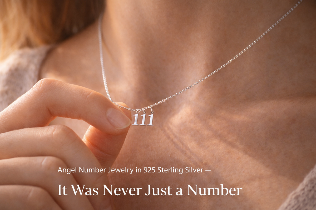 Woman holding 111 angel number necklace in 925 sterling silver — meaningful spiritual jewelry 2026