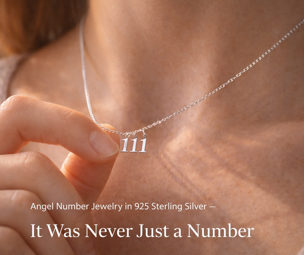 Woman holding 111 angel number necklace in 925 sterling silver — meaningful spiritual jewelry 2026