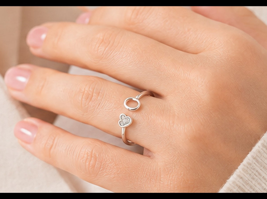 Woman wearing a delicate silver adjustable open ring with a heart detail — Jewelry Towns adjustable rings guide