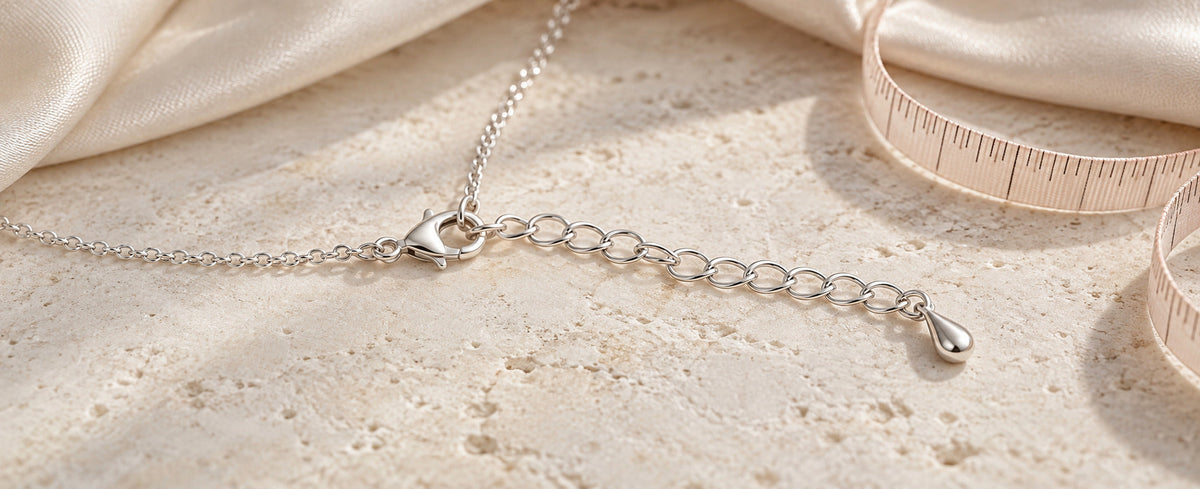 Sterling silver necklace clasp connected to an extender chain for Jewelry Towns guide