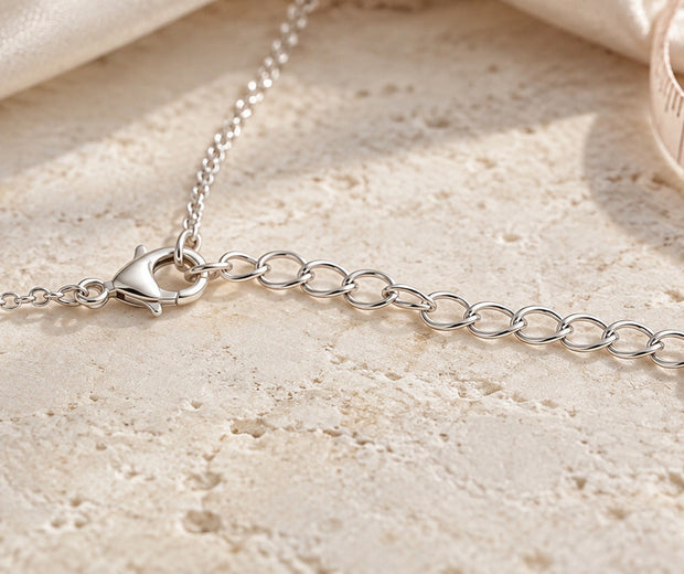 Sterling silver necklace clasp connected to an extender chain for Jewelry Towns guide