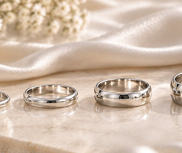 Four polished 925 sterling silver ring bands shown from narrow to wide for Jewelry Towns ring width guide