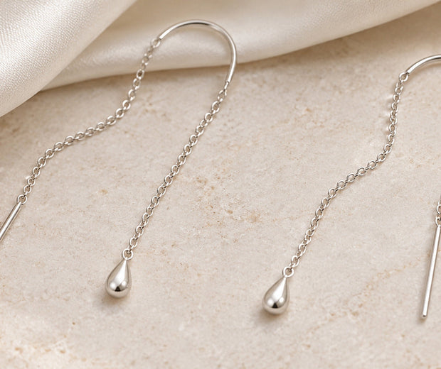 Fine sterling silver threader earrings showing chain bar and curved thread for Jewelry Towns guide