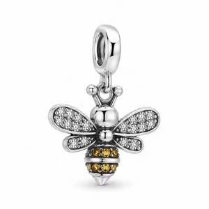 Three-quarter view of Jewelry Towns 925 sterling silver bee charm with zircon-set wings and amber details