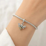 Jewelry Towns 925 sterling silver bee charm worn on a silver charm bracelet