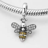 Close-up of Jewelry Towns 925 sterling silver bee charm on a bracelet with clear and amber zircon accents