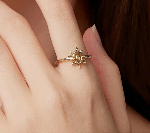 Woman-wearing-boho-celestial-sun-ring-gold-finish-on-hand