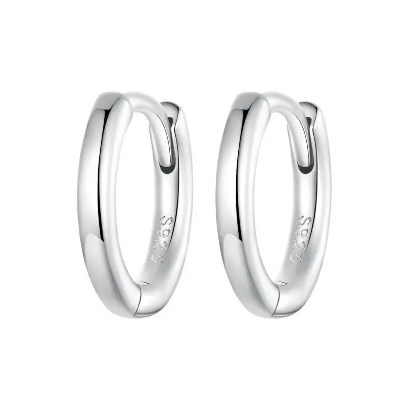 Sterling silver huggie hoop earring detail with cubic zirconia