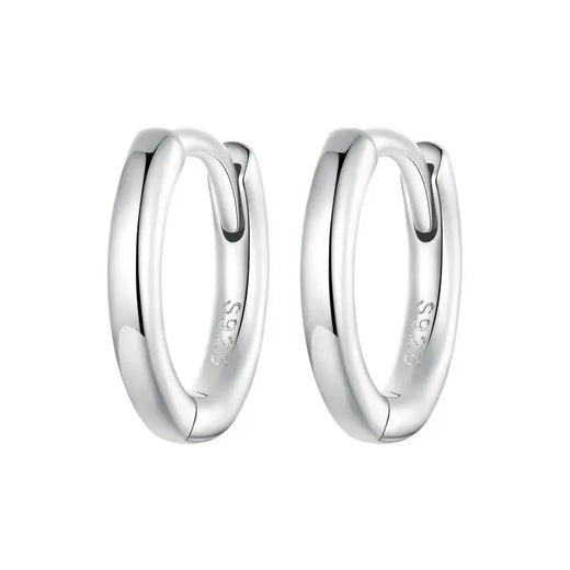 Sterling silver huggie hoop earring detail with cubic zirconia