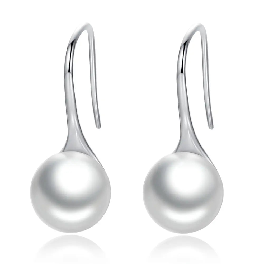Sterling silver pearl-style drop earrings detail