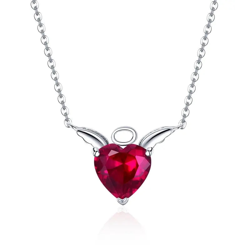 Red heart pendant with sculpted wing design in sterling silver
