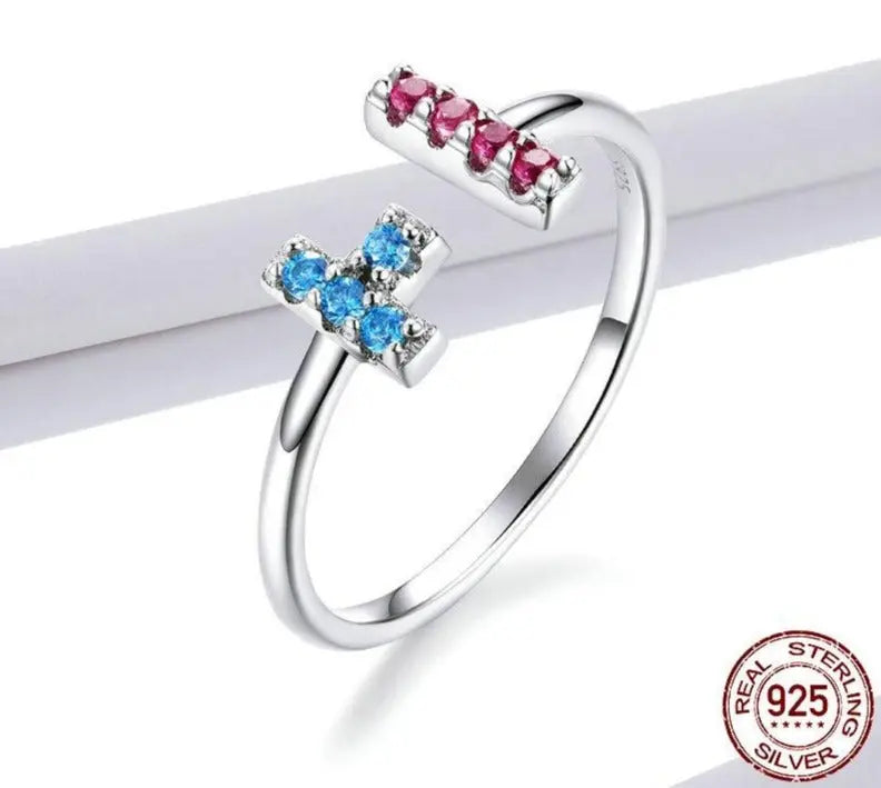Close-up of the geometric zircon stones on a thin sterling silver band.